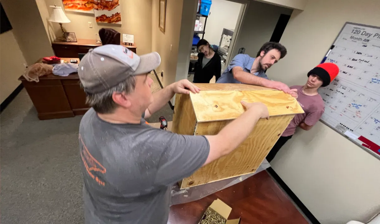 Volunteers building a blessing box